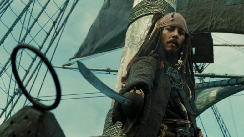 Captain Jack (Johnny Depp) draws a sword in Pirates of the Caribbean: Dead Man's Chest