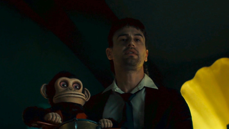 Bill holding the Monkey in The Monkey