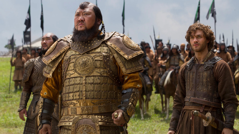 Kublai Khan, dressed in his warlord armor and his hand on his sword, and Marco Polo prepare for battle in "Marco Polo