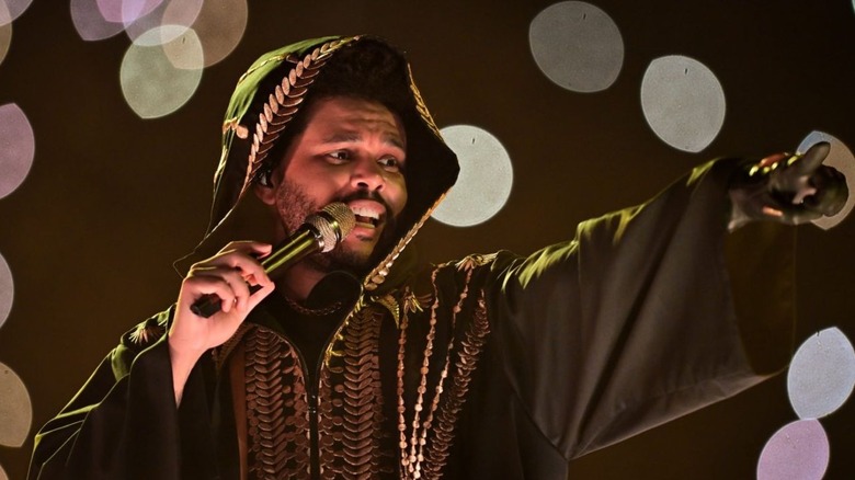 The Weeknd performing in Hurry Up Tomorrow.