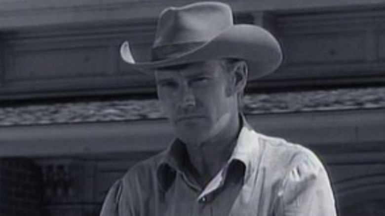 Lucas McCain (Chuck Connors) riding his horse through town in The Rifleman