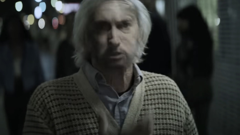 Eminem's face is superimposed over an elderly man in the Venom music video
