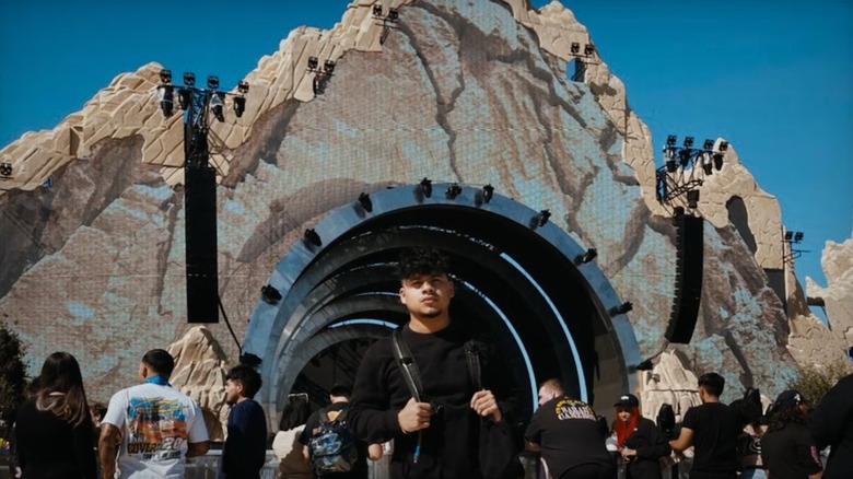 Rudy Pena in front of Travis Scott's mountain stage at Astroworld, from Trainwreck: The Astroworld Tragedy