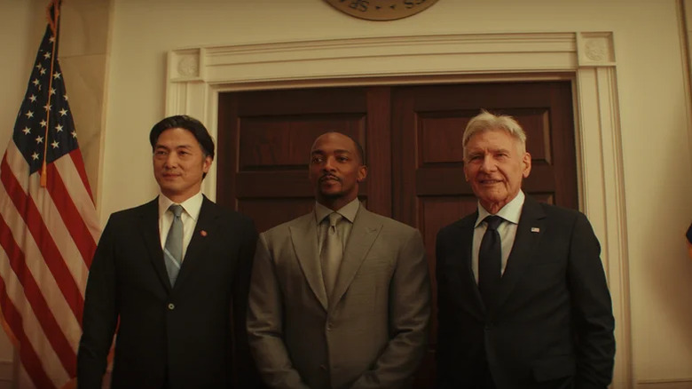 Sam Wilson stands next to President Ross and Prime Minister Ozaki in Captain America: Brave New World