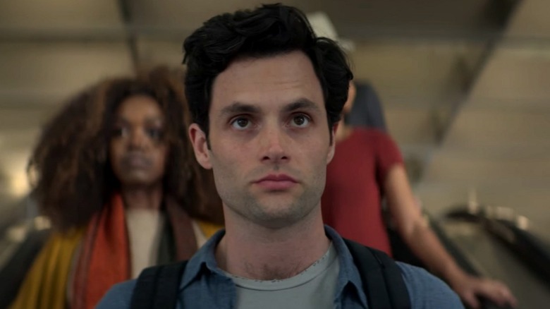 Joe Goldberg (Penn Badgley) descends an escalator to hell in You
